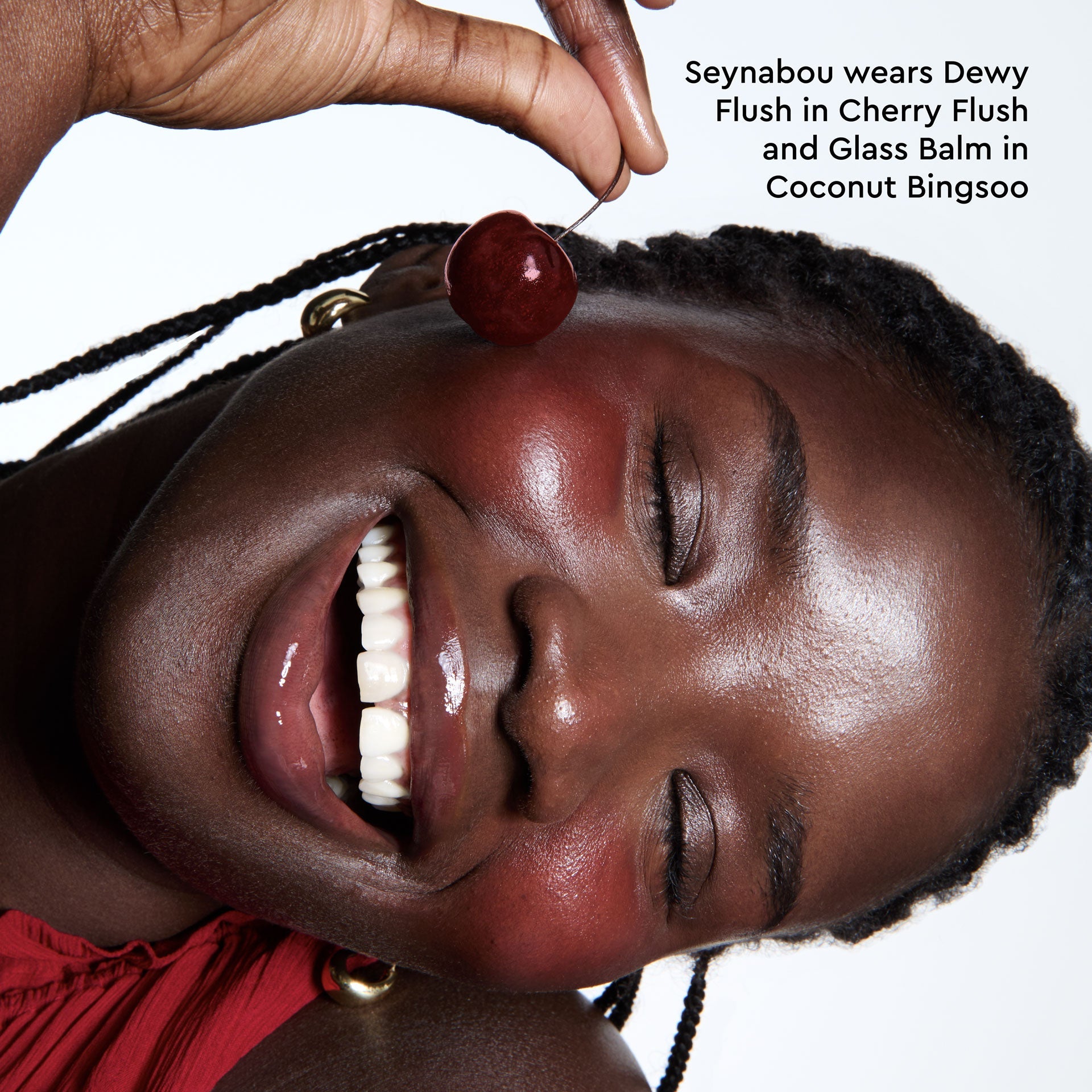 A different close-up captures Cherry Flush freshly applied and blending into a model's cheek.