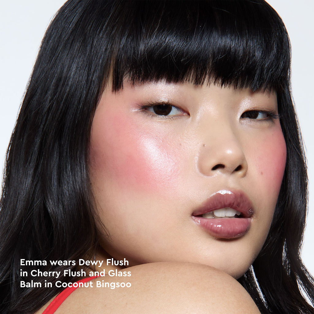 A model's cheeks are shown flushed with Cherry Flush in a close-up on-face application shot.