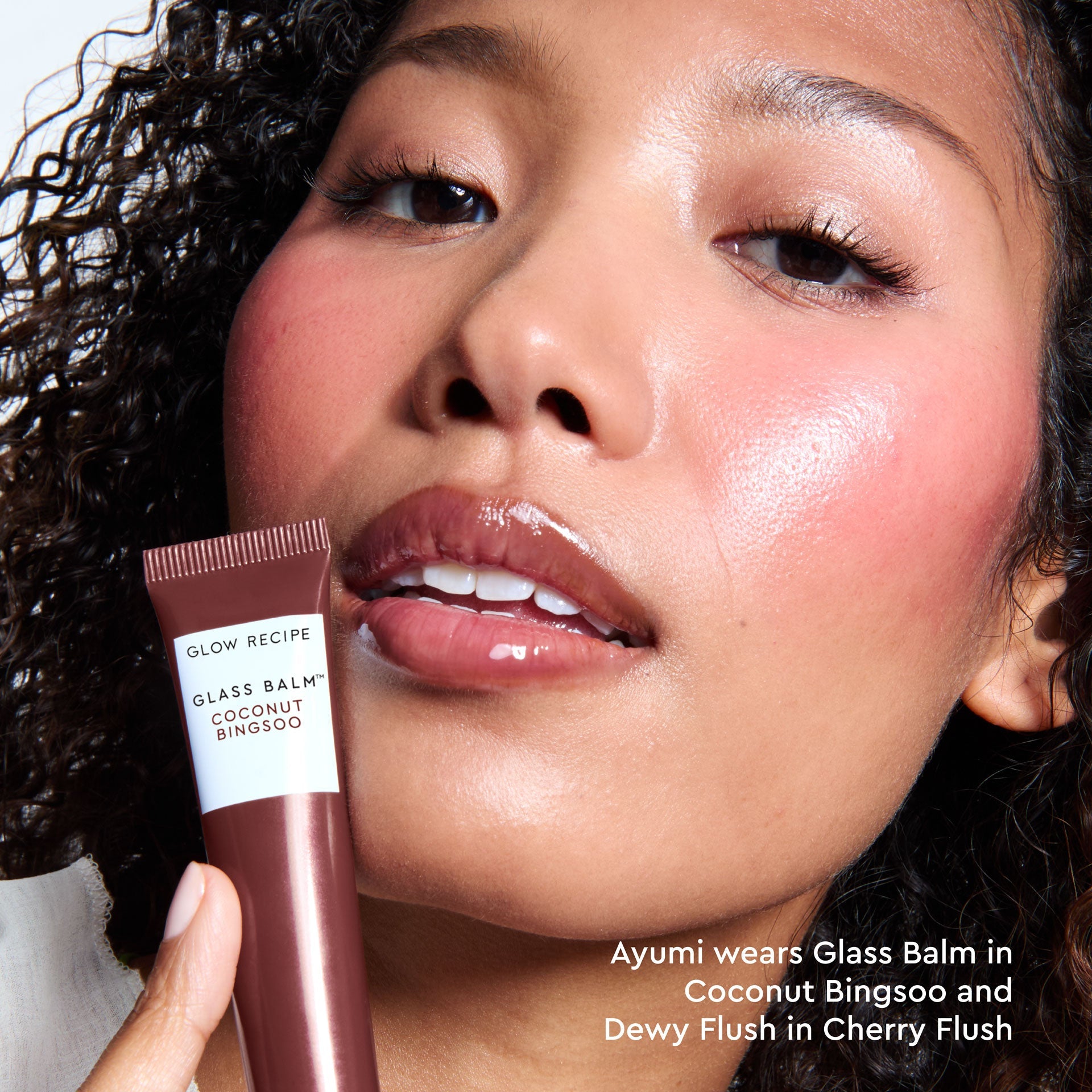 Third model close-up wearing Glass Balm in Coconut Bingsoo, showing the sheer cool-brown lip tint.