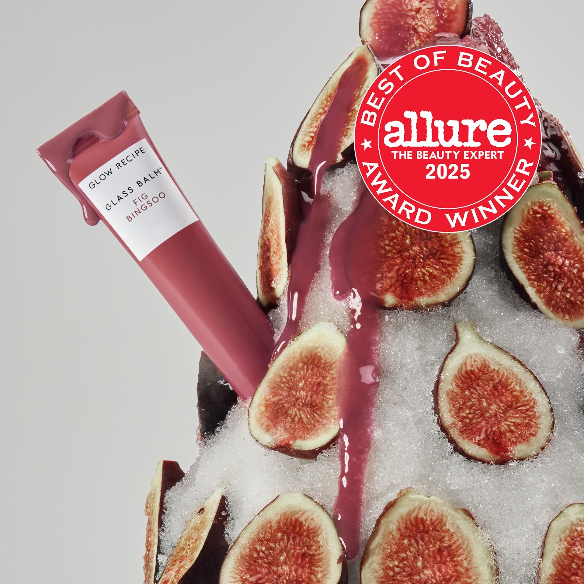 Teaser shot of the Fig-colored Glass Balm lip tint from the Fig + Watermelon Lip & Cheek Kit.