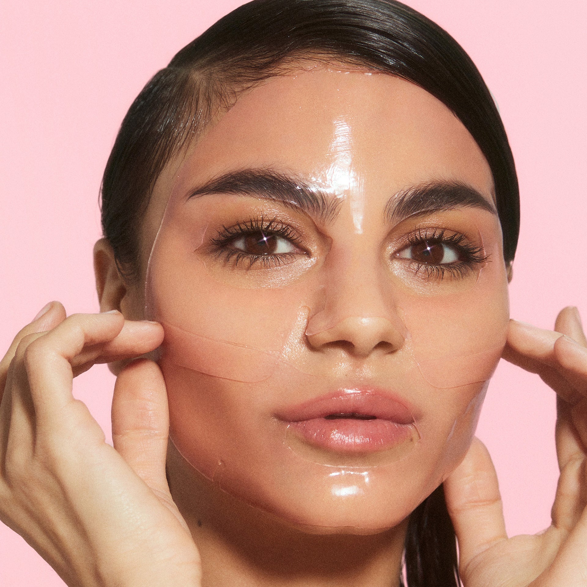 Watermelon Glow Jelly Sheet Mask unfolded to show its two-piece jelly design soaked in cooling watermelon serum.
