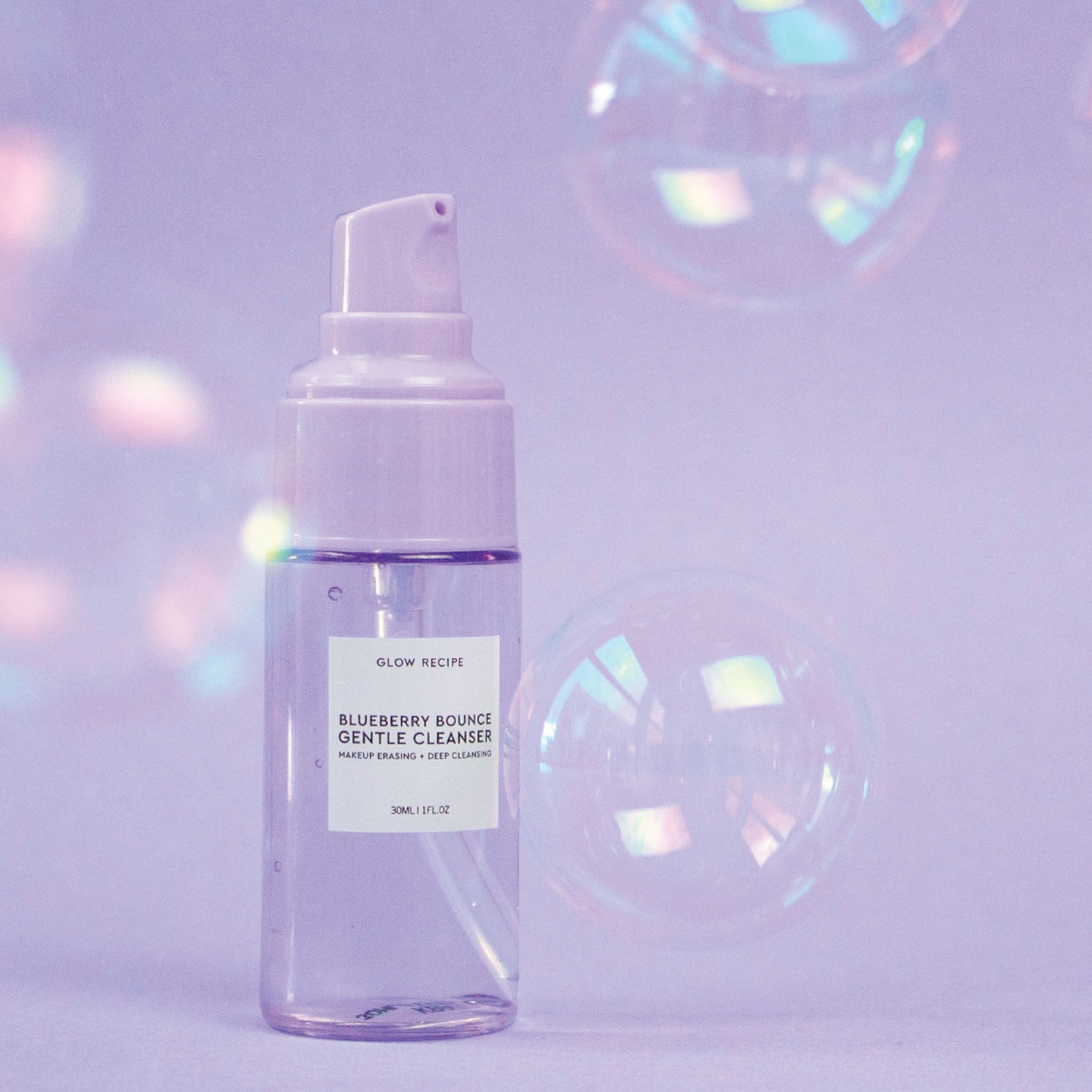 Glow Recipe Mini Blueberry Bounce Gentle Cleanser in its travel-size (30ml) bottle shown on a product claims callout card.