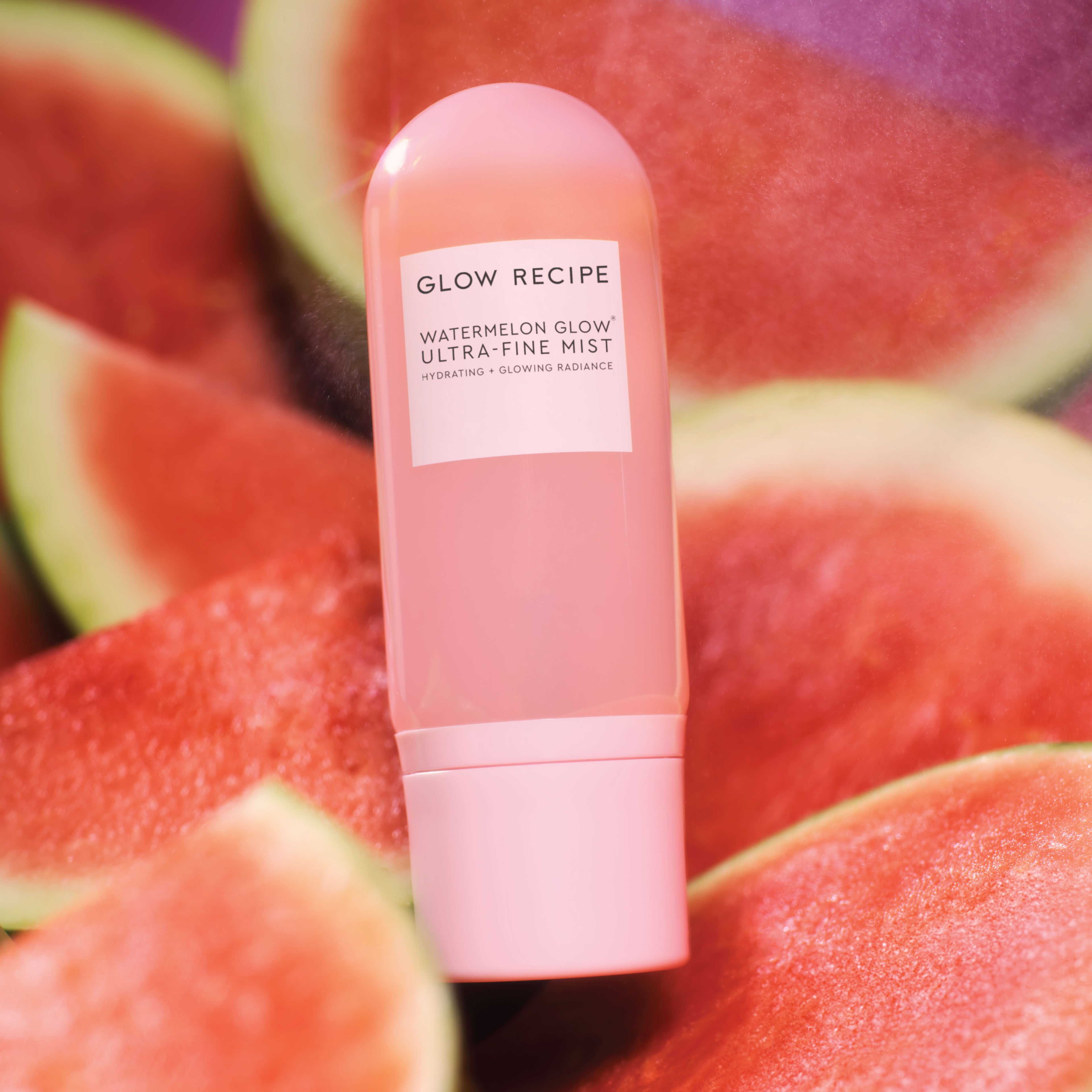 Glow Recipe Watermelon Glow Ultra-Fine Mist claim graphic detailing its bi-phase blend of watermelon and hibiscus AHAs.