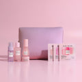 Glow Recipe Glow to Go Travel Kit with pink neoprene carryall and 8-piece skincare essentials