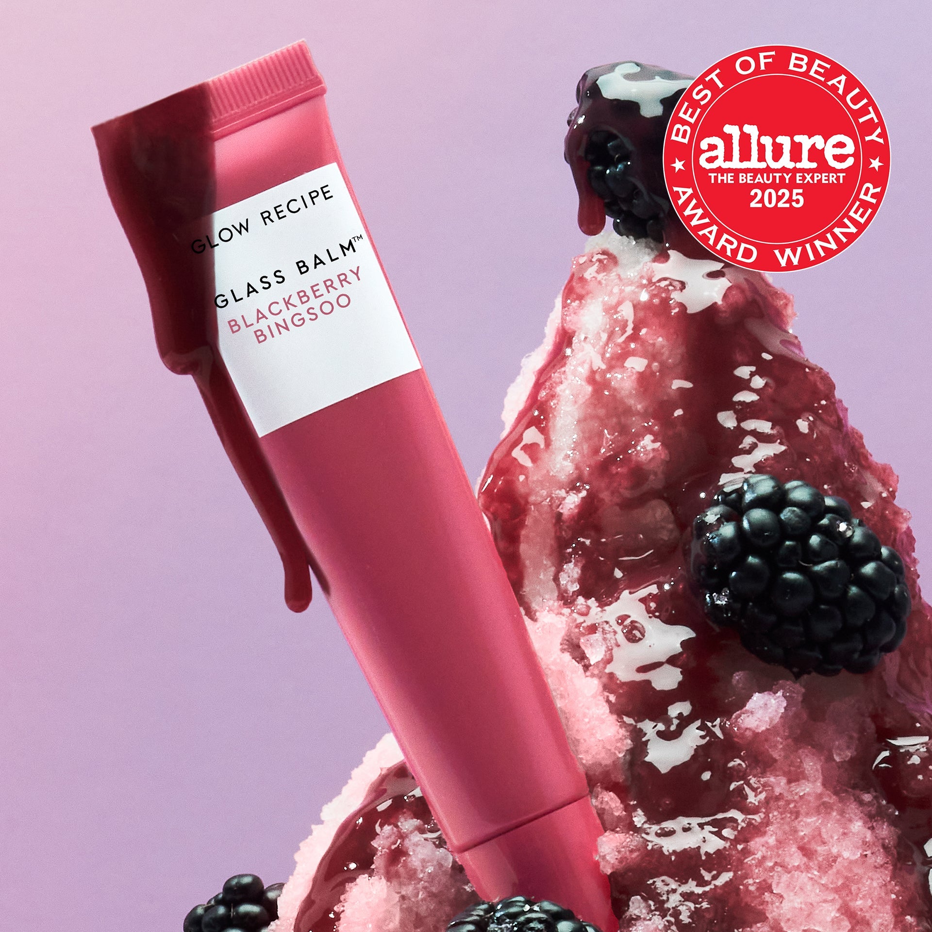 Allure Best of Beauty seal badge over the Glass Balm tube in Blackberry Bingsoo, a sheer berry shade.