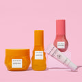 Four skincare products from Glow Recipe on a pink background