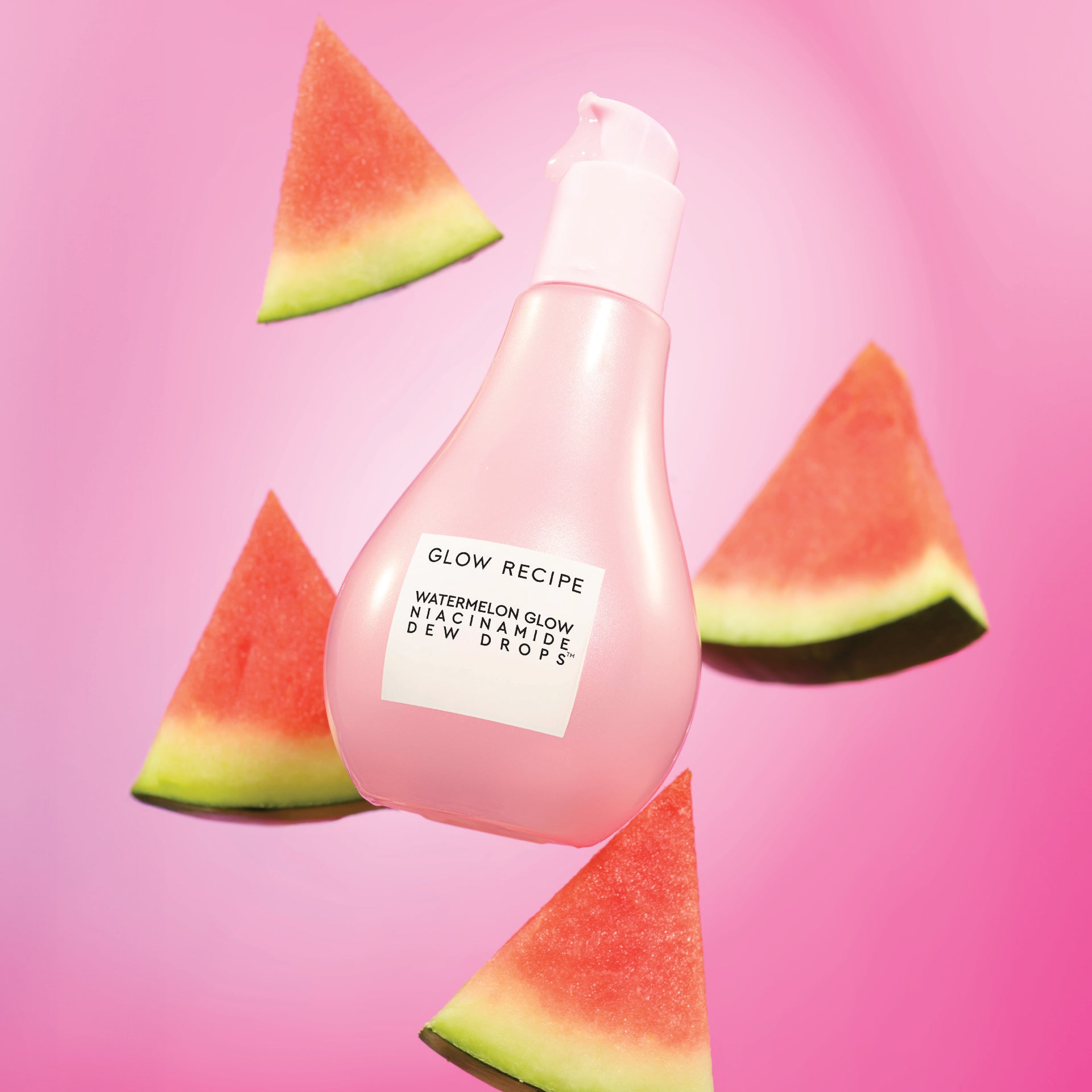 Pink bottle labeled 'Glow Recipe' with watermelon slices on a pink background
