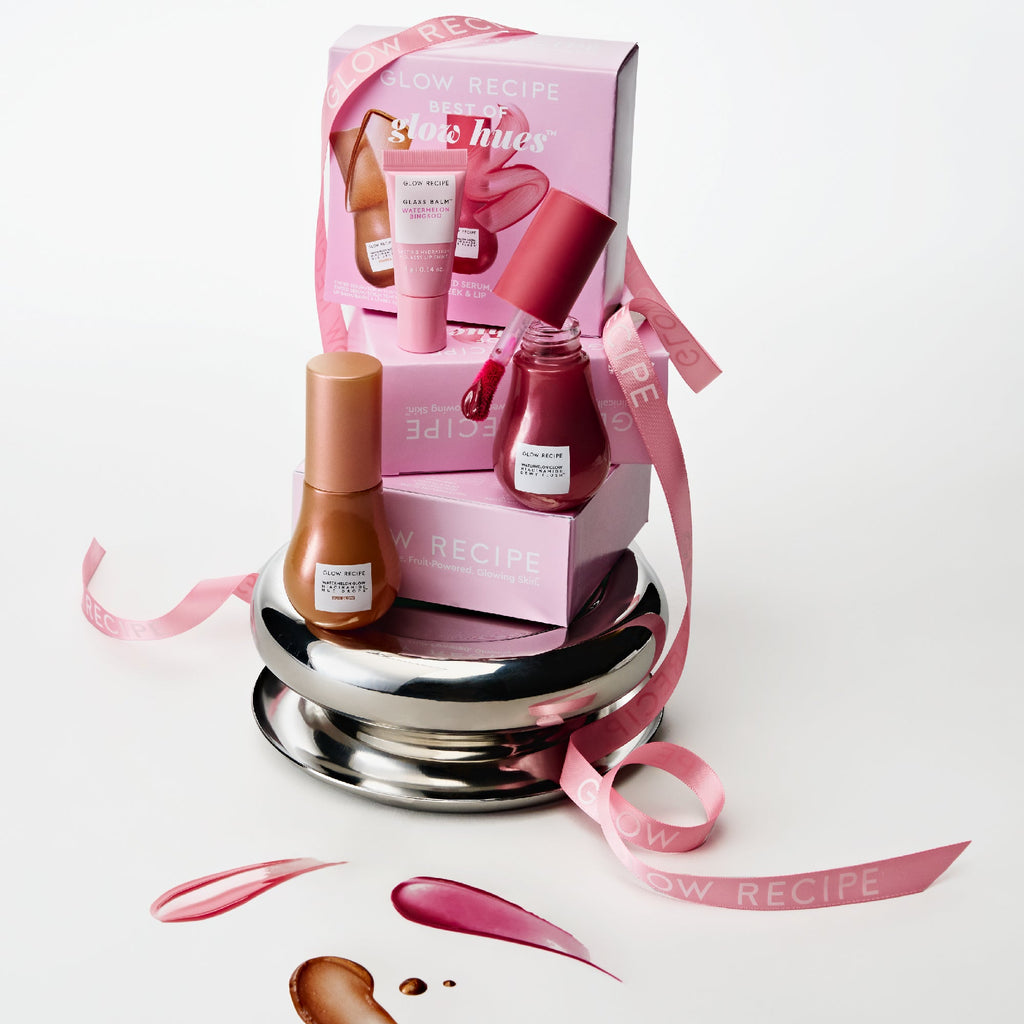 Glow Recipe Best of Glow Hues Kit lifestyle shot featuring the tinted serum, blush drops, and lip balm trio.