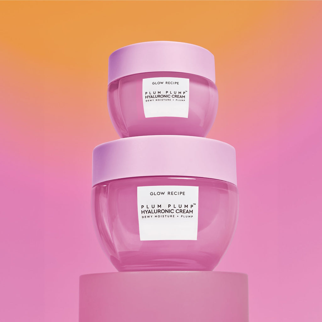 Mini Size (20ml) Plum Plump Hyaluronic Cream jars stacked on top of each other against an orange-to-pink gradient backdrop.