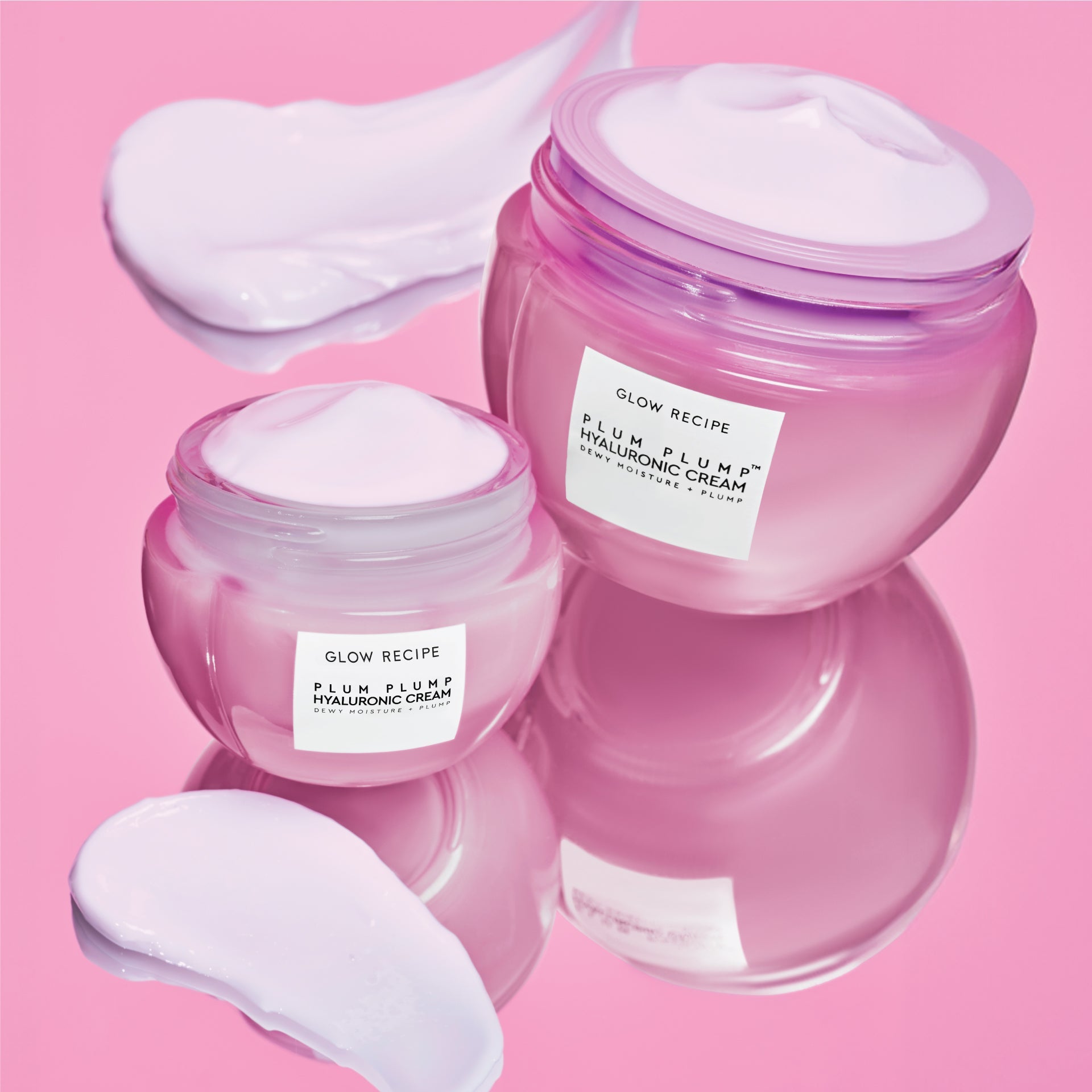 Two Mini Size (20ml) jars of Glow Recipe Plum Plump Hyaluronic Cream displayed side by side on a soft pink background.