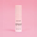 Skincare serum bottle with 'Glow Recipe' on a pink background