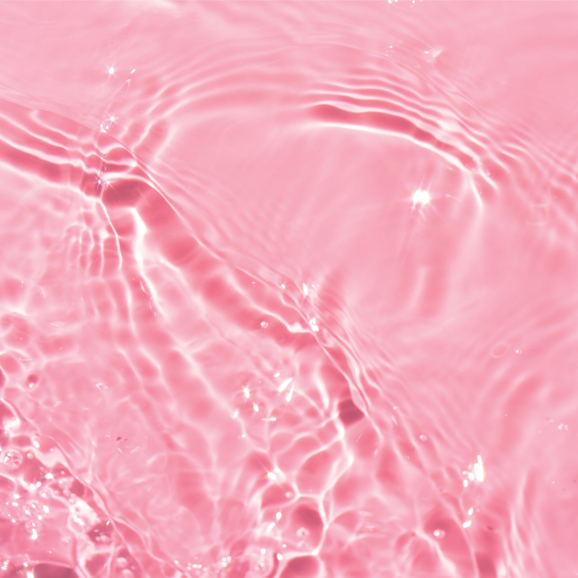 Clear toner liquid on top of pink background.