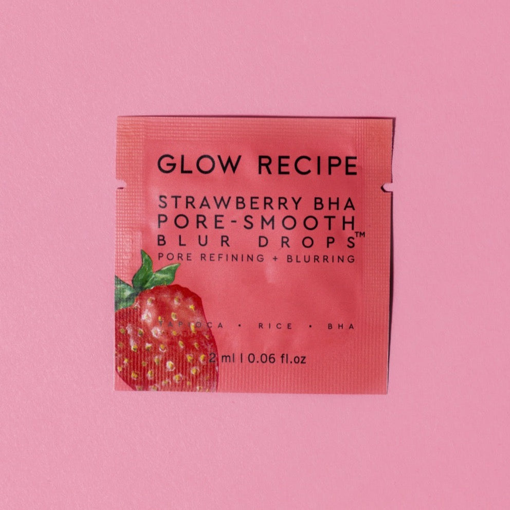 Glow Recipe Strawberry BHA Pore-Smooth Blur Drops packaging on a pink background