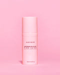 Pink skincare product bottle with 'Glow Recipe' on a pink background