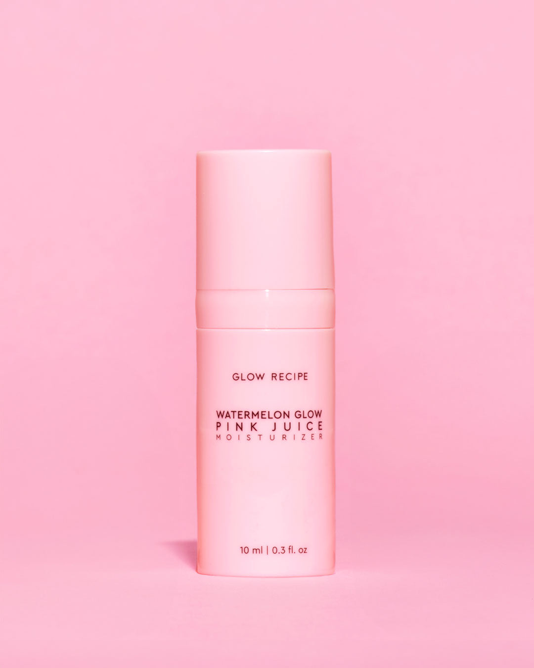 Pink skincare product bottle with 'Glow Recipe' on a pink background